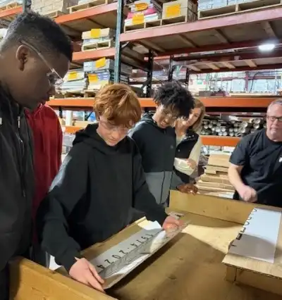 students measuring a sign